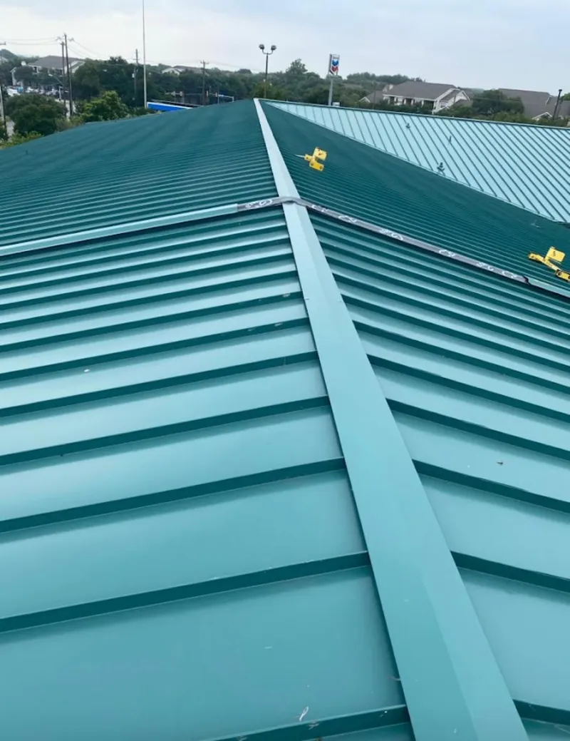 Green commercial metal roof ridge and valley for Metal Roof Repair in Spring Arbor